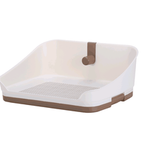 Portable dog potty training tray in medium brown color with sturdy wall for puppy toilet training.