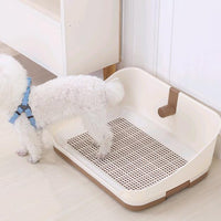 portable dog potty training tray with a small dog standing on it, ideal for puppy toilet training.